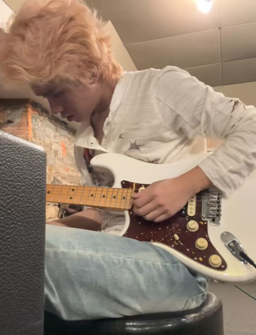 Close-up of an electric guitar being played